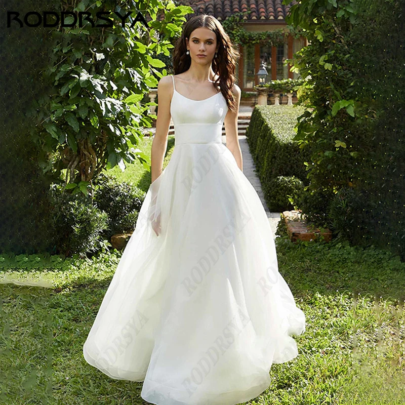 

Женское свадебное платье RODDRSYA, а-силуэт в стиле бохо, на тонких бретельках, с открытой спиной, пляжное платье невесты с глубоким вырезом, без рукавовсвадебное платье RODDRSYA, а-силуэт в стиле бохо, на тонких брете