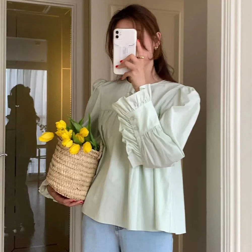 

South Korea chic spring sweet and gentle round neck crease feeling loose casual solid color flared sleeve shirt blouse women