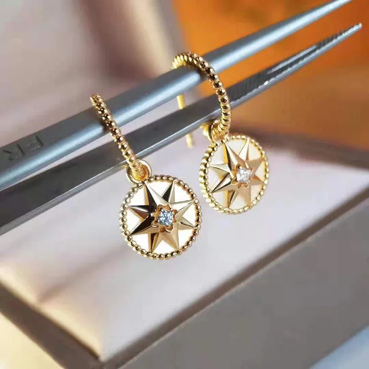 

Needle Stud Earrings Eight Awn Star Compass White Shell Earrings Female Niche Temperament European And American Cold Style