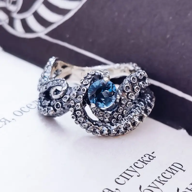 

Octopus Ring. London Blue Topaz. Garnet. Handmade Jewelry. Custom Jewelry.