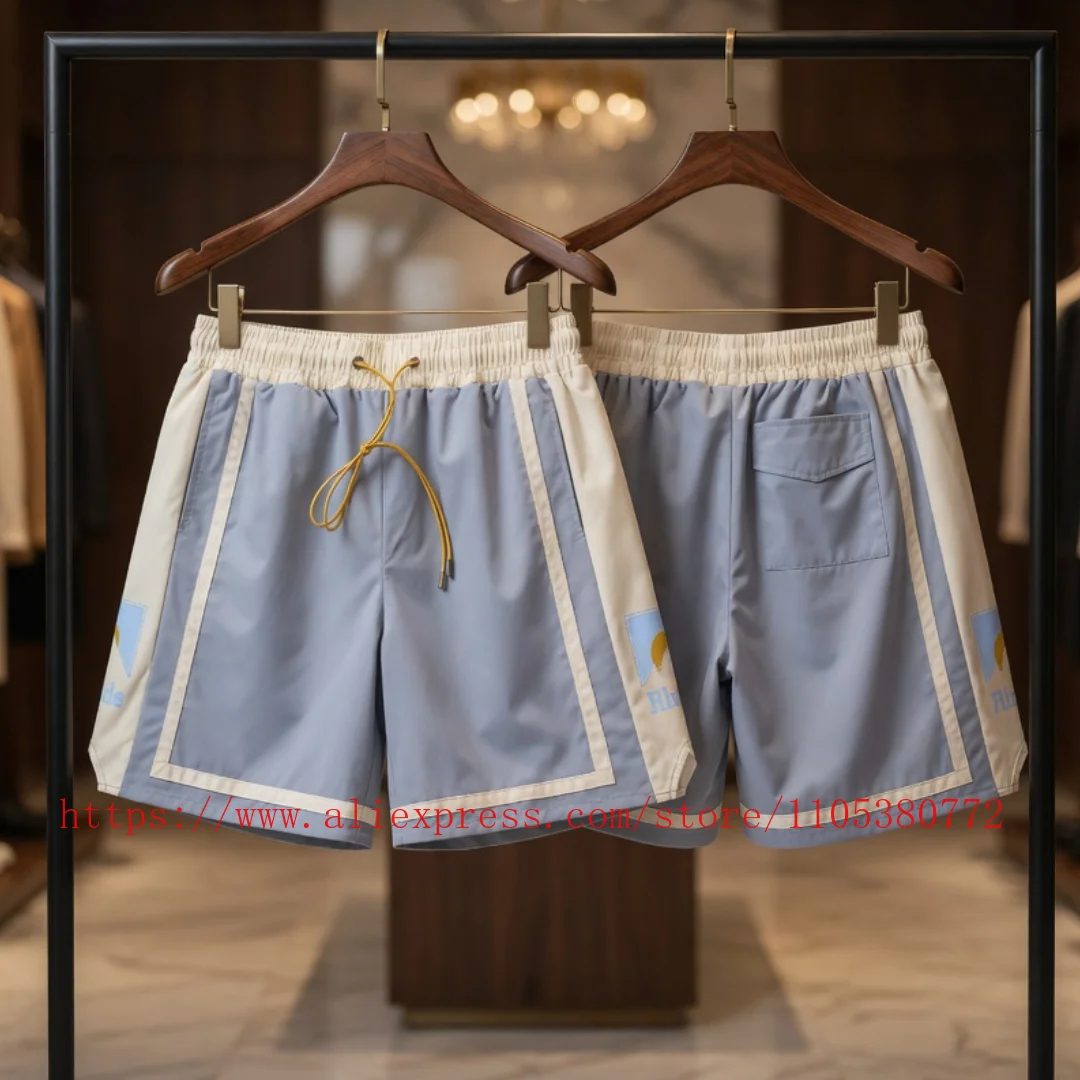Фото Новые мужские спортивные шорты RHUDE в стиле ретро с цветными вставками, светло-голубые, на шнурке, для уличной моды, пляжные шорты №1