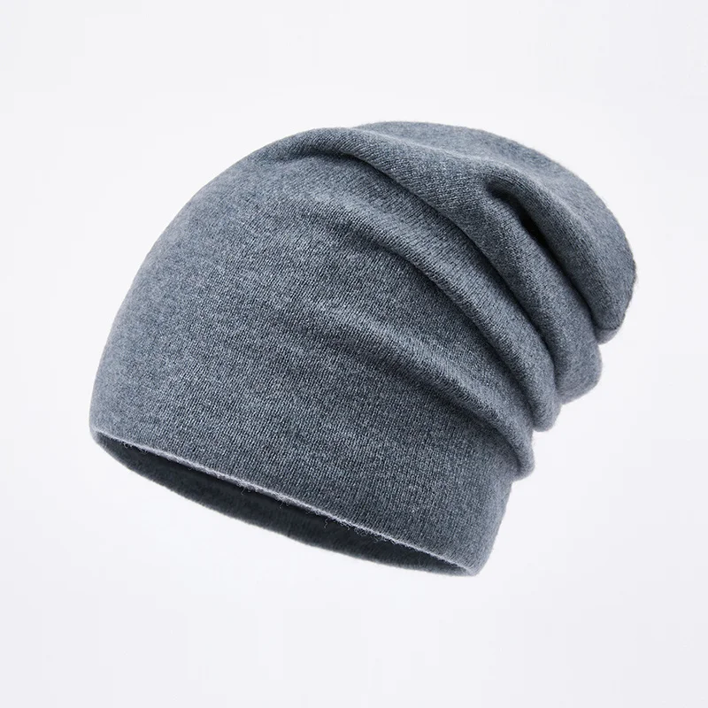 

100% pure wool men's hats piles of hats, warm wool woven hats. In winter, young people go out to keep out the cold cashmere hats