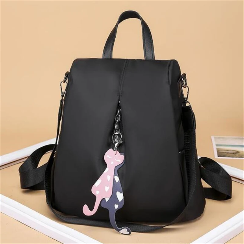 

Anti-theft Nylon Backpack Solid Color Large Daypack for Female Bagpack with Cat Pendant Women Simple Travel Shoulder Bags Pack