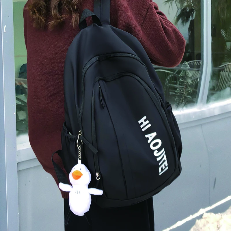 

Новинка 2023, женский рюкзак, модный однотонный нейлоновый школьный ранец, Повседневный Женский дорожный рюкзак, черный вместительный рюкзак...