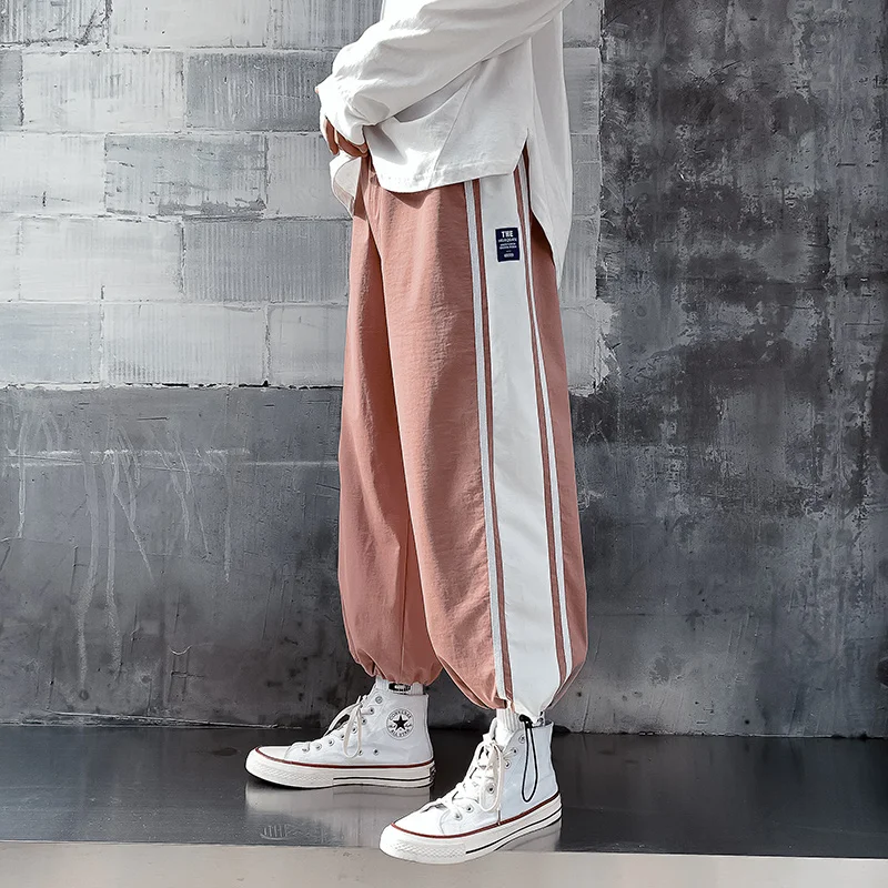 

2022 latest men's summer loose casual nine division pants men and women lovers pink black casual pants