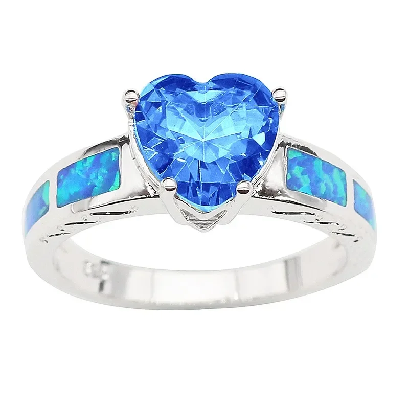 Женское кольцо с голубым кристаллом и опалом