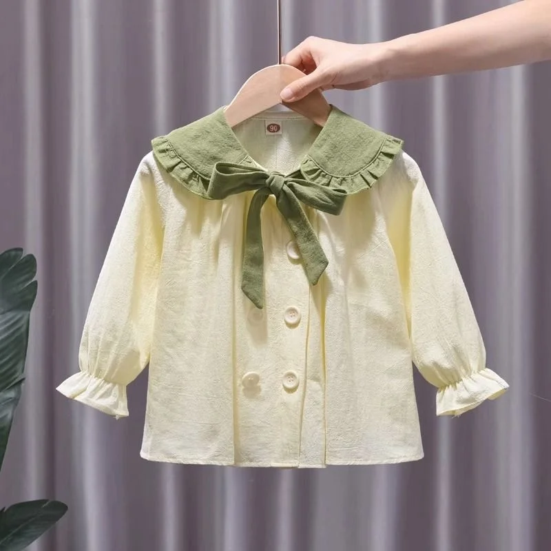 

Girls' lapel top 2023 new spring and autumn long sleeved button bow shirt children's color matching casual shirt