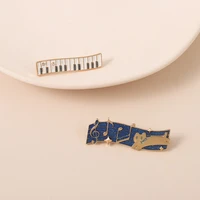 xedz cartoon music symbol cat jumping metal enamel brooches custom funny white piano keys music pins lapel badge accessories