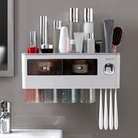 magnetic adsorption inverted toothbrush holder automatic toothpaste dispenser squeezer storage rack bathroom accessories set