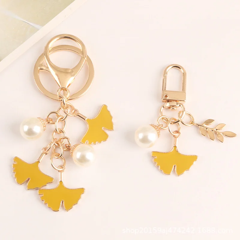 

Pearl leaf alloy key chain pendant simulation Apricot Leaf children's hair badge accessories earphone bag decoration