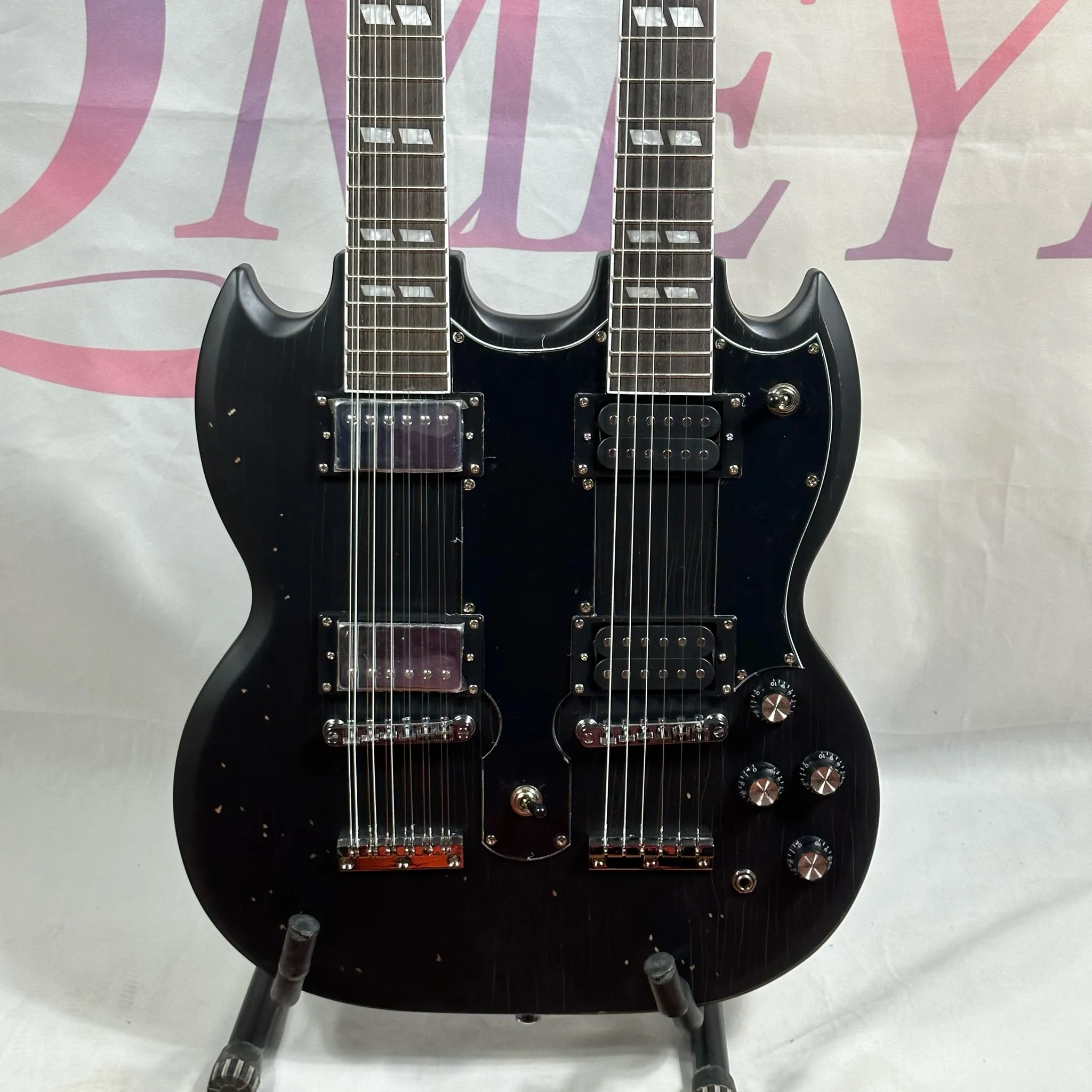 

Aged Black Double Neck Electric Guitar Carved Top Custom Stem Inlays