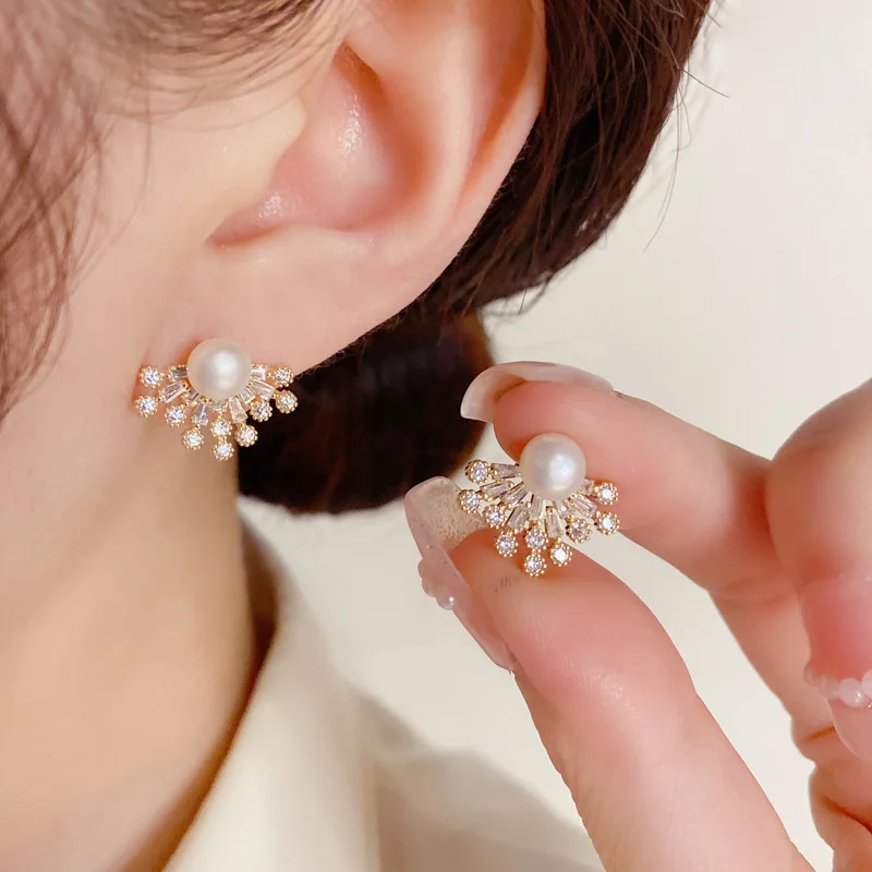 

Korean version of exquisite fashion super flash zircon freshwater pearl earrings light luxury unique design earrings for women.