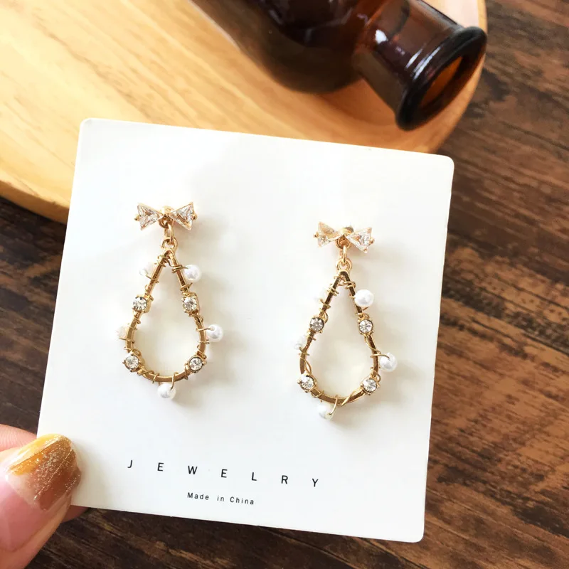 

Cubic Zircon Water Drop Clip Earrings Bowknot Brief Temperament Aesthetic Earrings