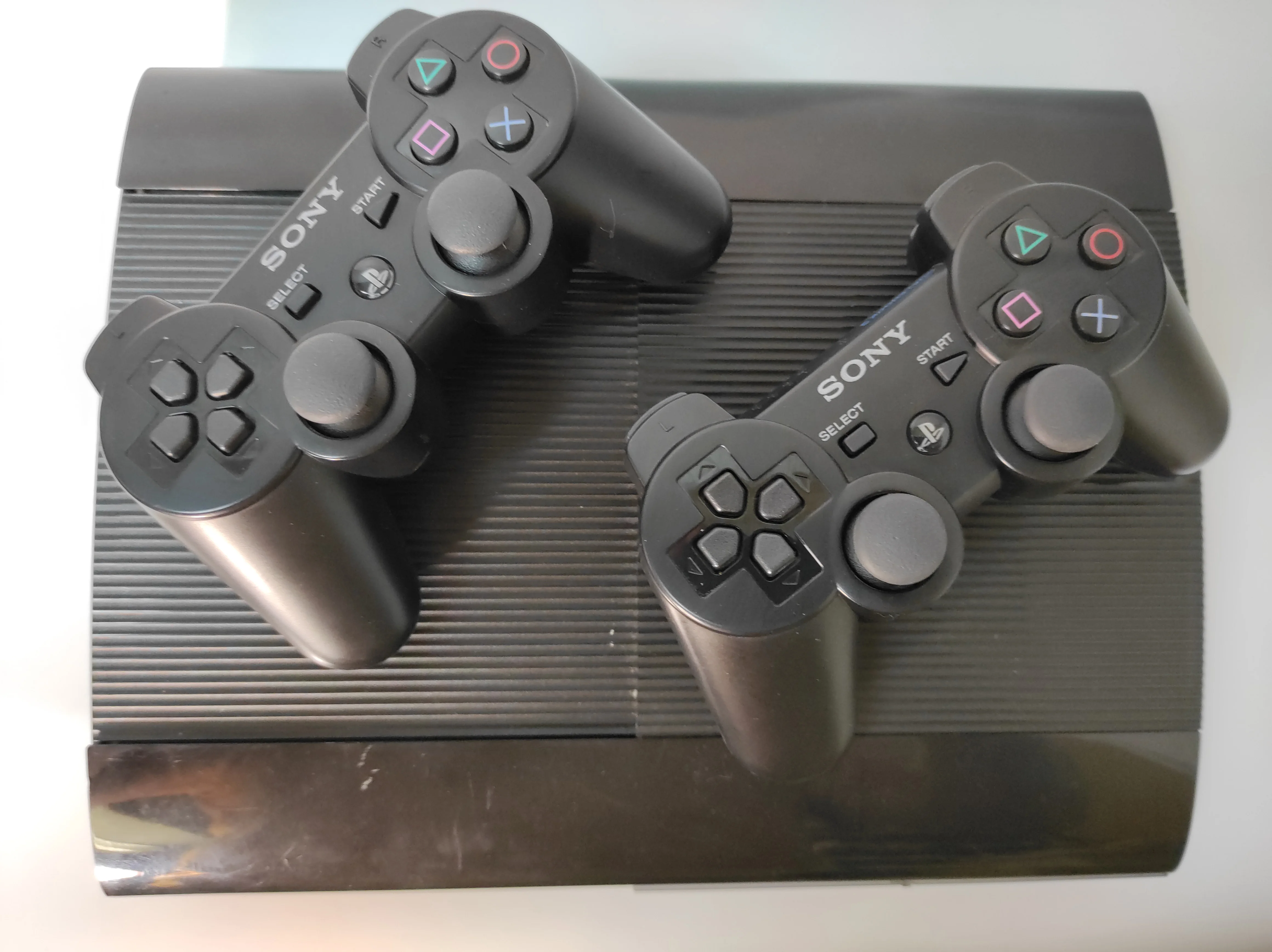 Игровая приставка PS3 super slim 500gb HEN 3.0.3 Б/У +2 Геймпада ( Оригинал ) +40игр на HDD - купить