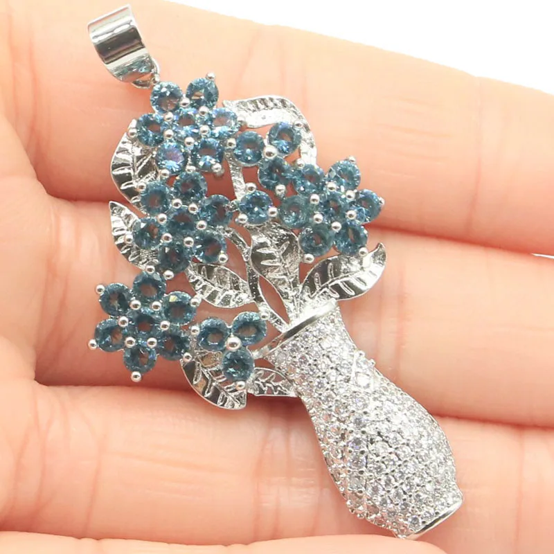 Большая роскошная ваза с зеленым Перидотом лондонским голубым топазом 57x29 мм