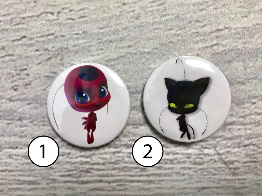 Значки Тикки и Плагг |