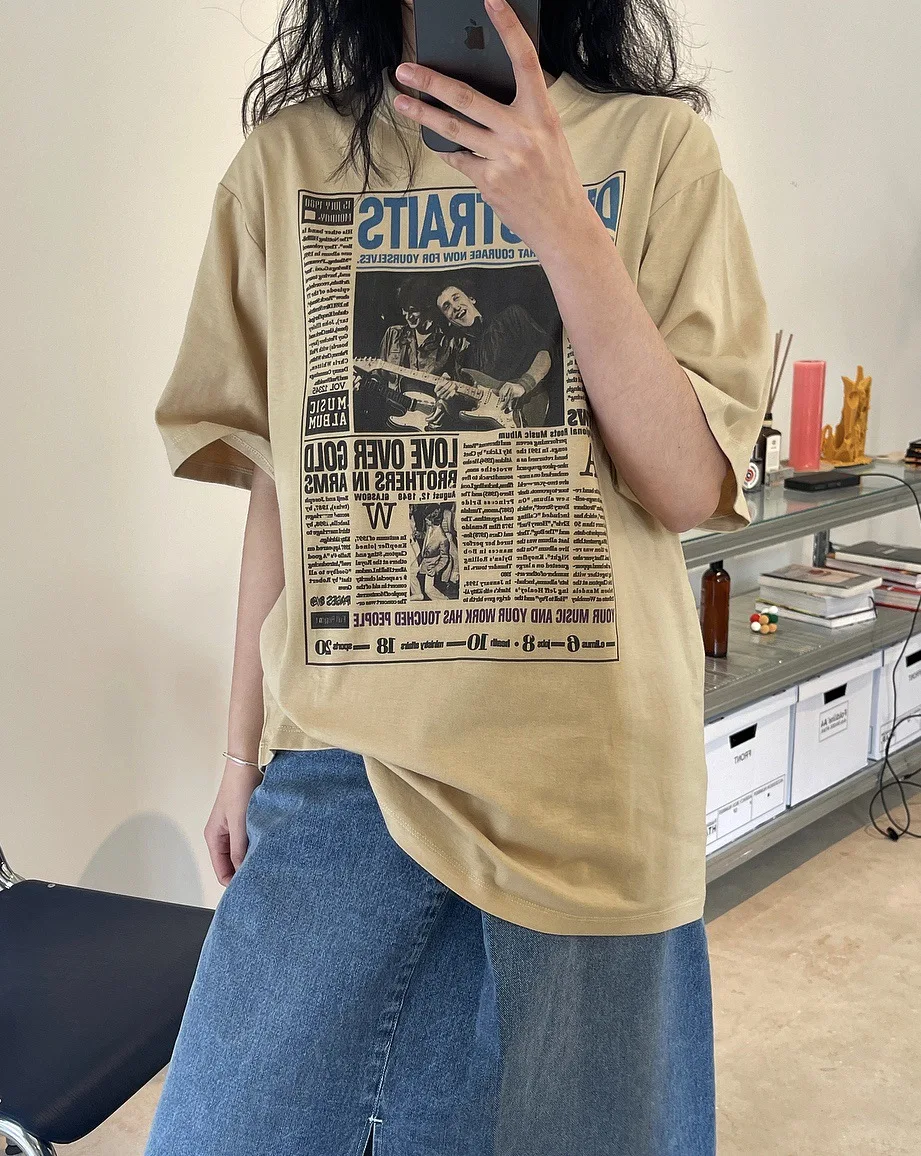 

woman full cozy T-shirt with newspaper print