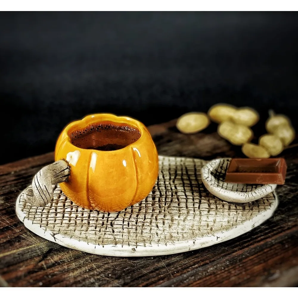 

Pumpkin-shaped coffee cup with coffee and mini pumpkin gifts cup mug