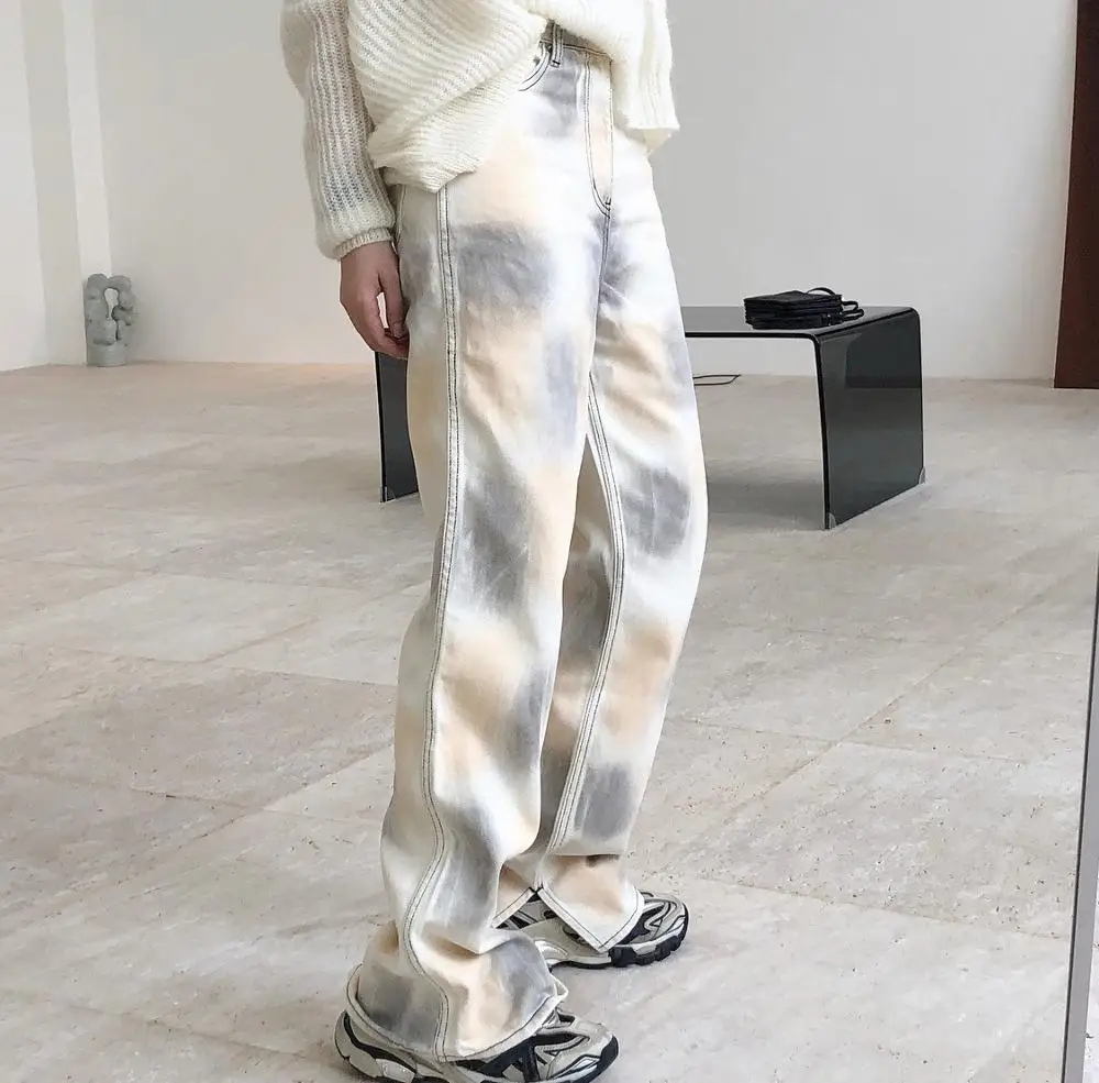 woman long straight white jeans tai-dai style