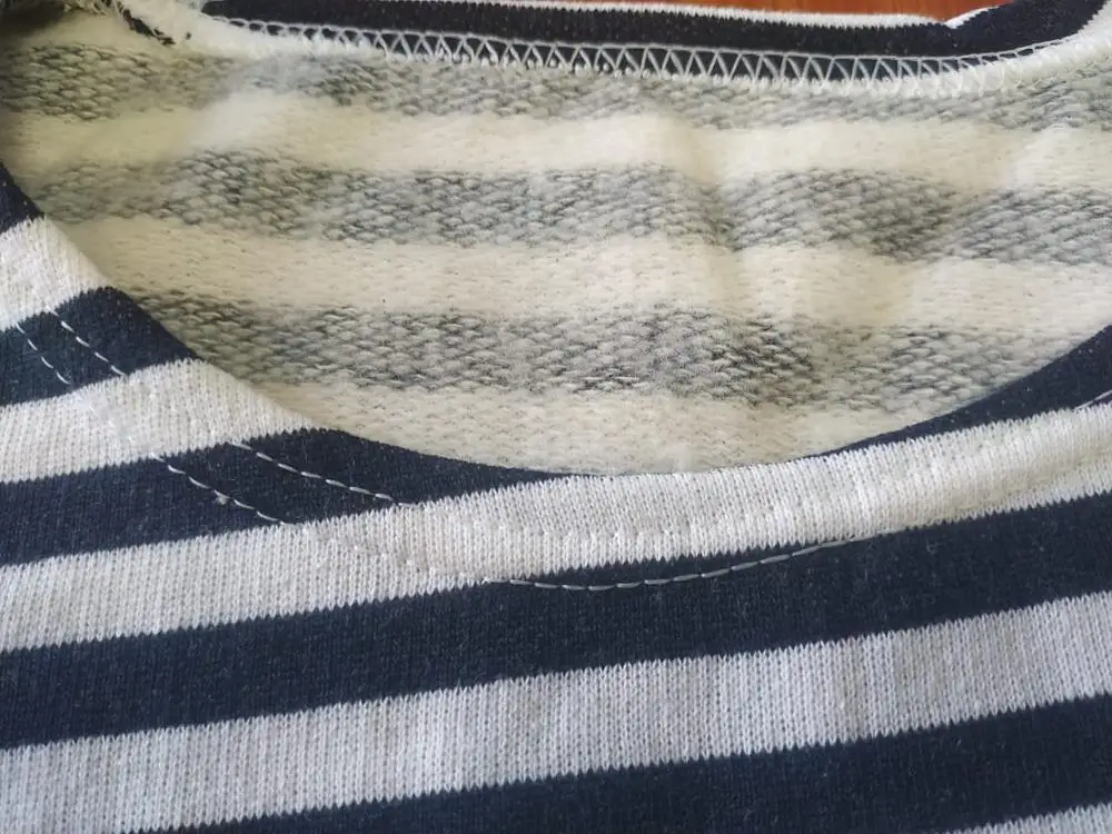 A vest with a fleece on bike cotton blue and black strip. |