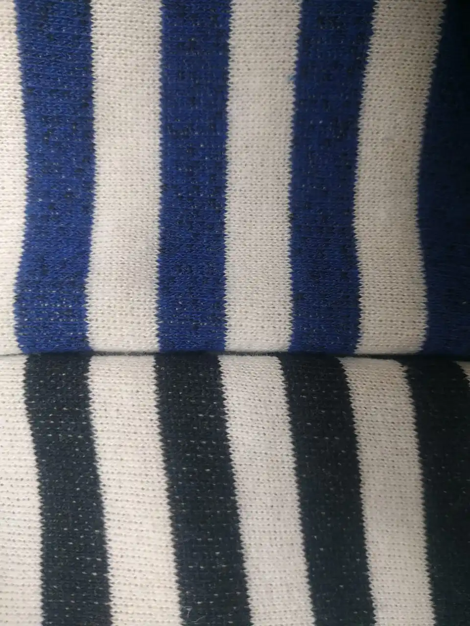 A vest with a fleece on bike cotton blue and black strip. |