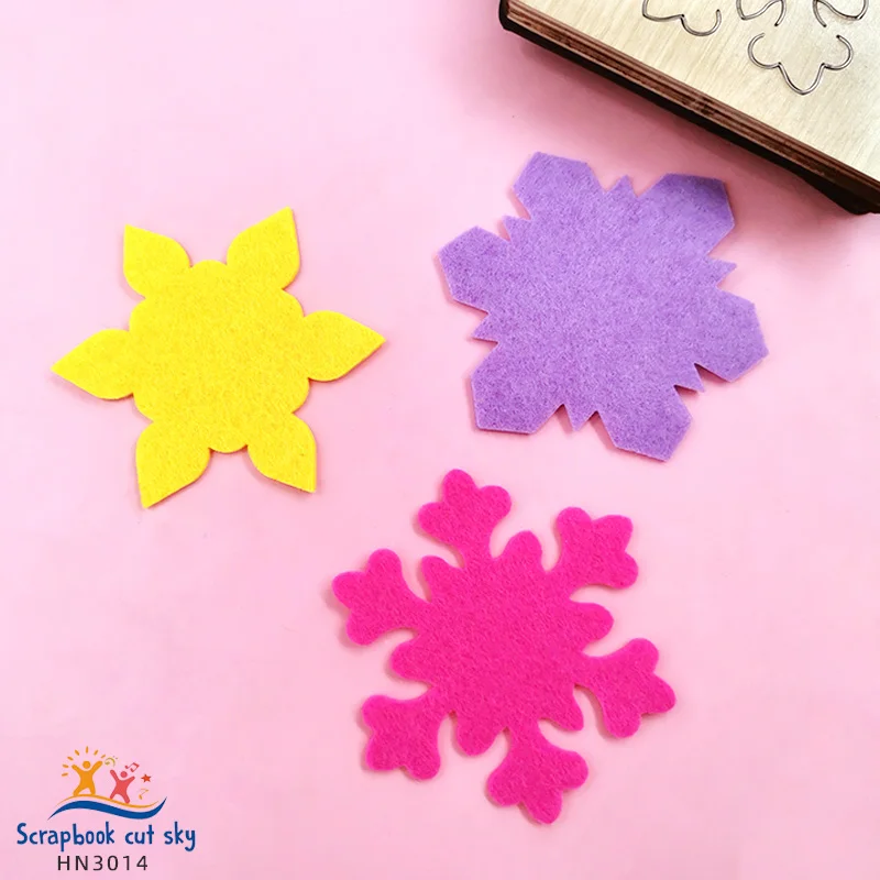 

Three pieces of snowflake die-cut wooden mold for scrapbooking