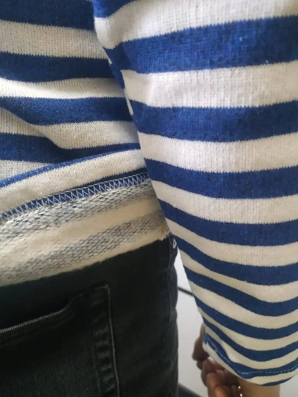 A vest with a fleece on bike cotton blue and black strip. |