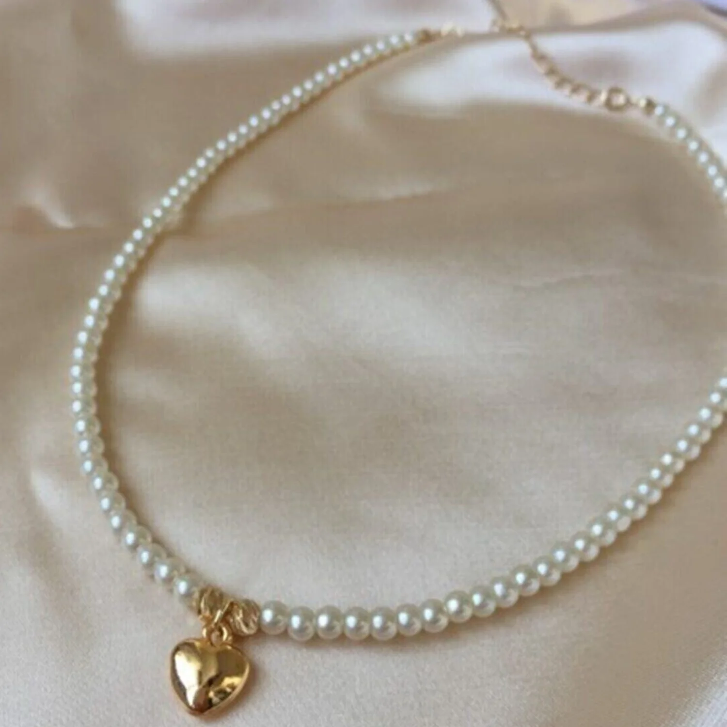 

Gold plated heart pendant necklace with pearls