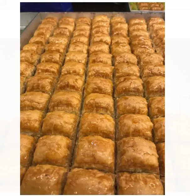 

BAKLAVA WITH WALNUT WRAP WITH SUGAR WITH ITS GREAT TASTE AND AMAZING AROMA (1 Kg.) FREE SHIPPING