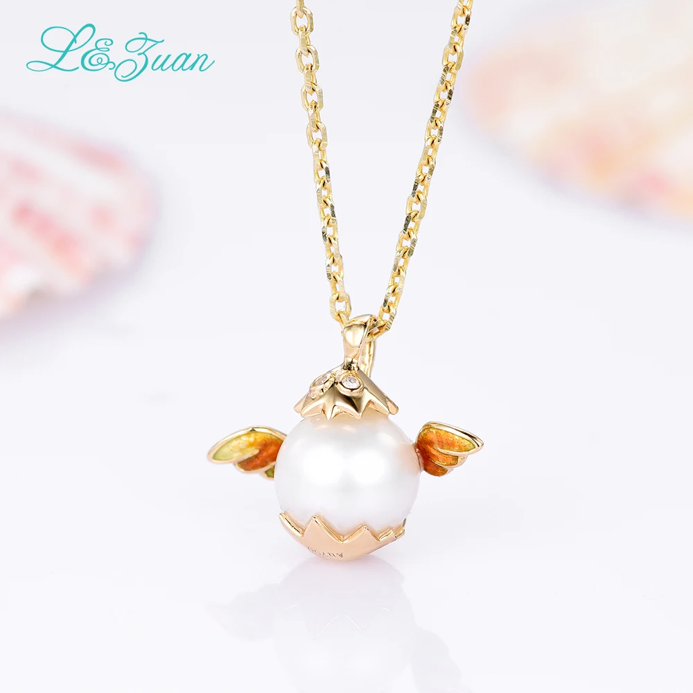 Кулон из серебра 0501 пробы с пресноводным жемчугом и крыльями желтого золота 18