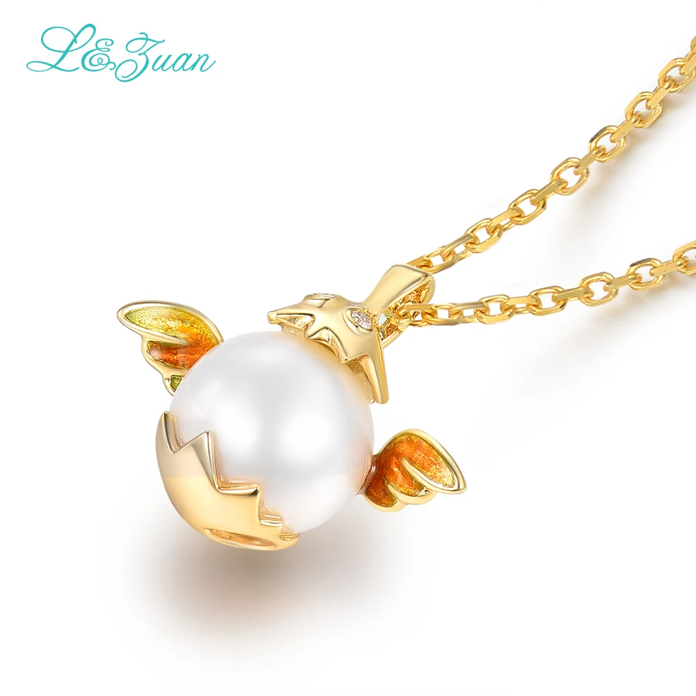 Кулон из серебра 0501 пробы с пресноводным жемчугом и крыльями желтого золота 18