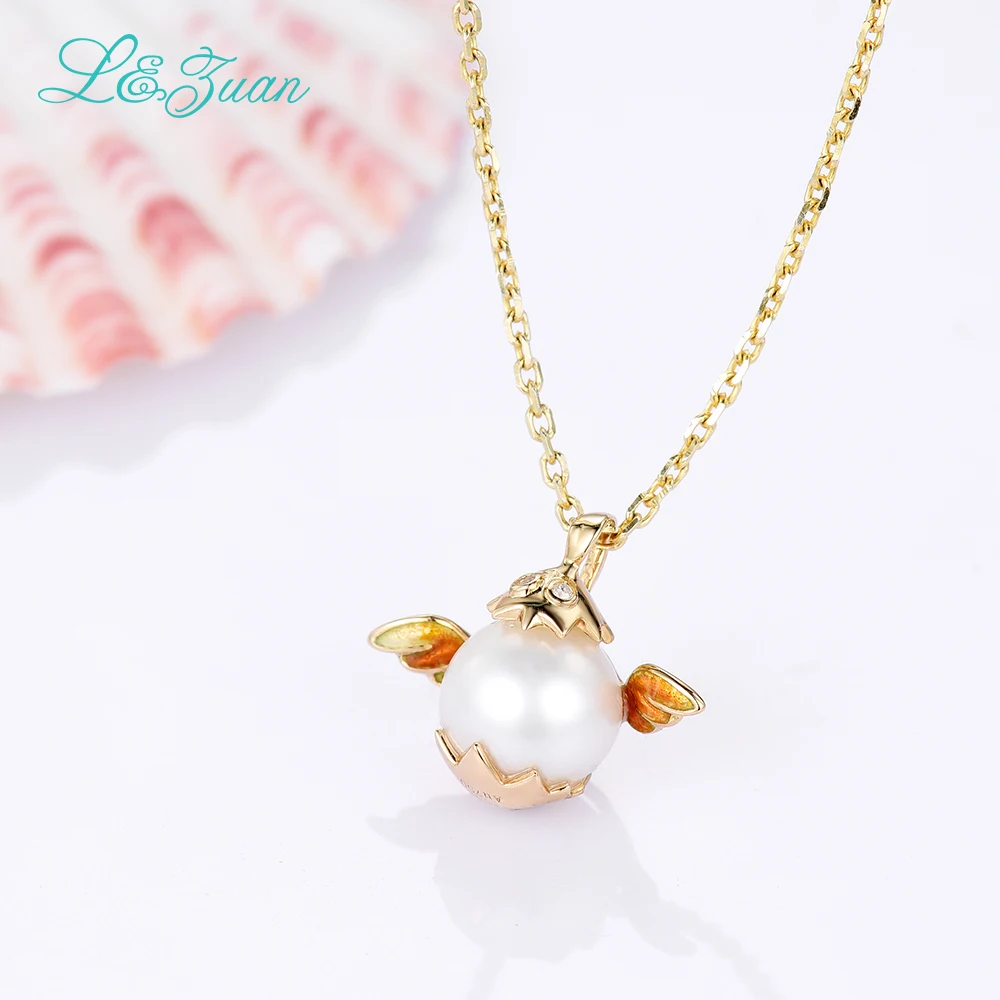 Кулон из серебра 0501 пробы с пресноводным жемчугом и крыльями желтого золота 18