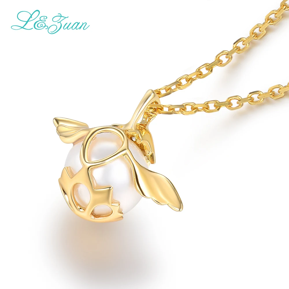 Кулон из серебра 0501 пробы с пресноводным жемчугом и крыльями желтого золота 18