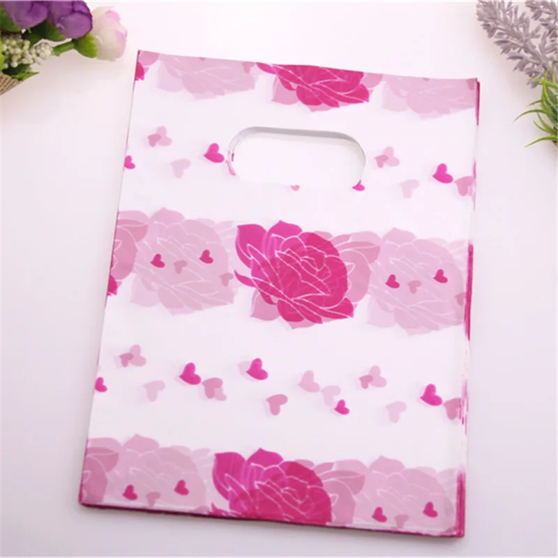 

Hot Sale Wholesale 100pcs/lot 15*20cm Hot Pink Plastic Lovely Rose Flower Shopping Bags Favor Party Gift Packaging