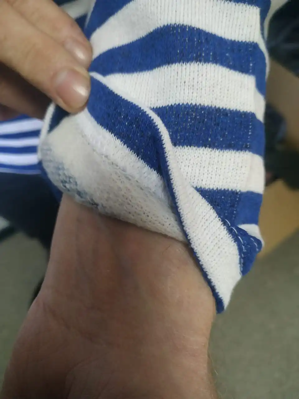 A vest with a fleece on bike cotton blue and black strip. |