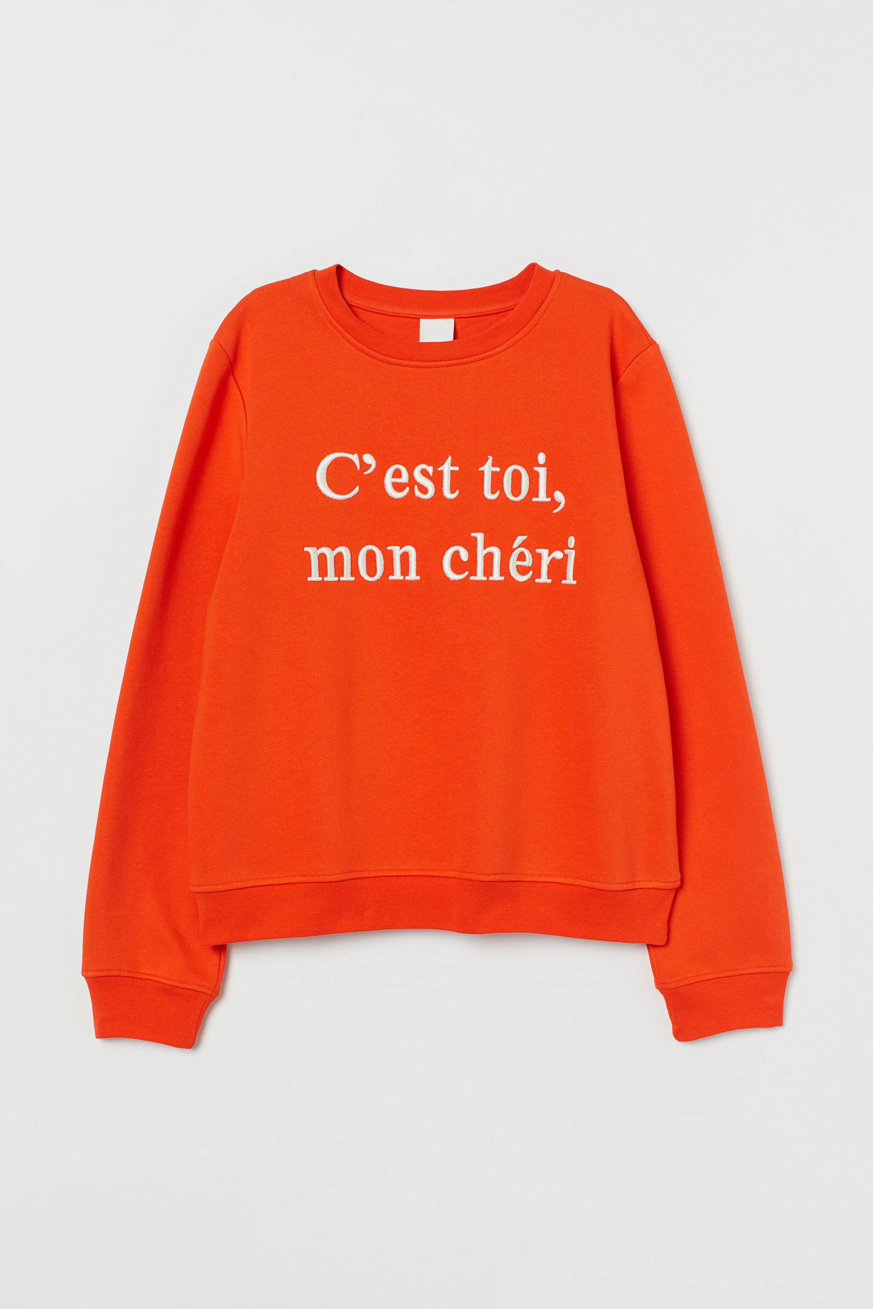 

Short, boxy shirt made of soft sweat fabric with a print of motifs on the front, dropped shoulders and long, slightly wider slee