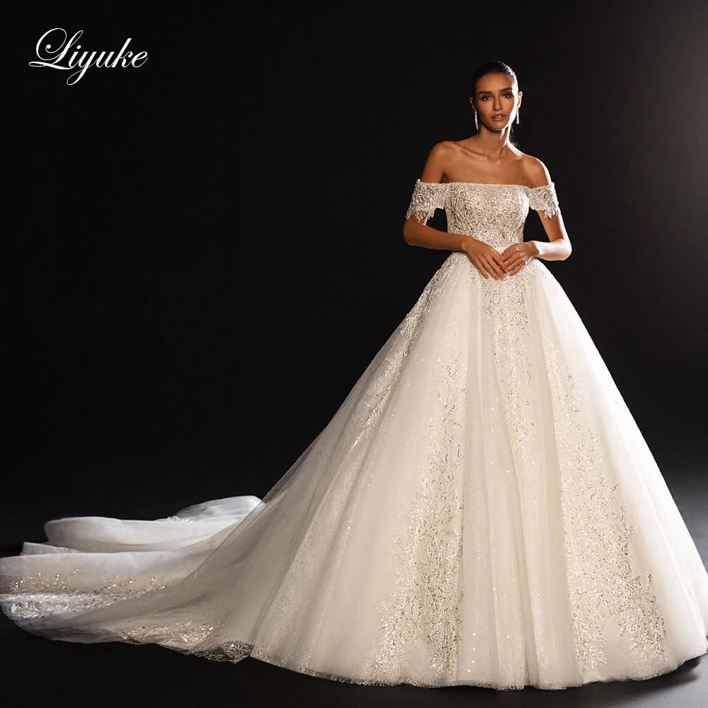 

Liyuke Off The Shoulder Boat Neckline A Line Wedding Dress With Sequins Lace Crystals Backless Bridal Dress