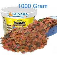 1000 gram tetramine flake food dividing from bucket fish feed