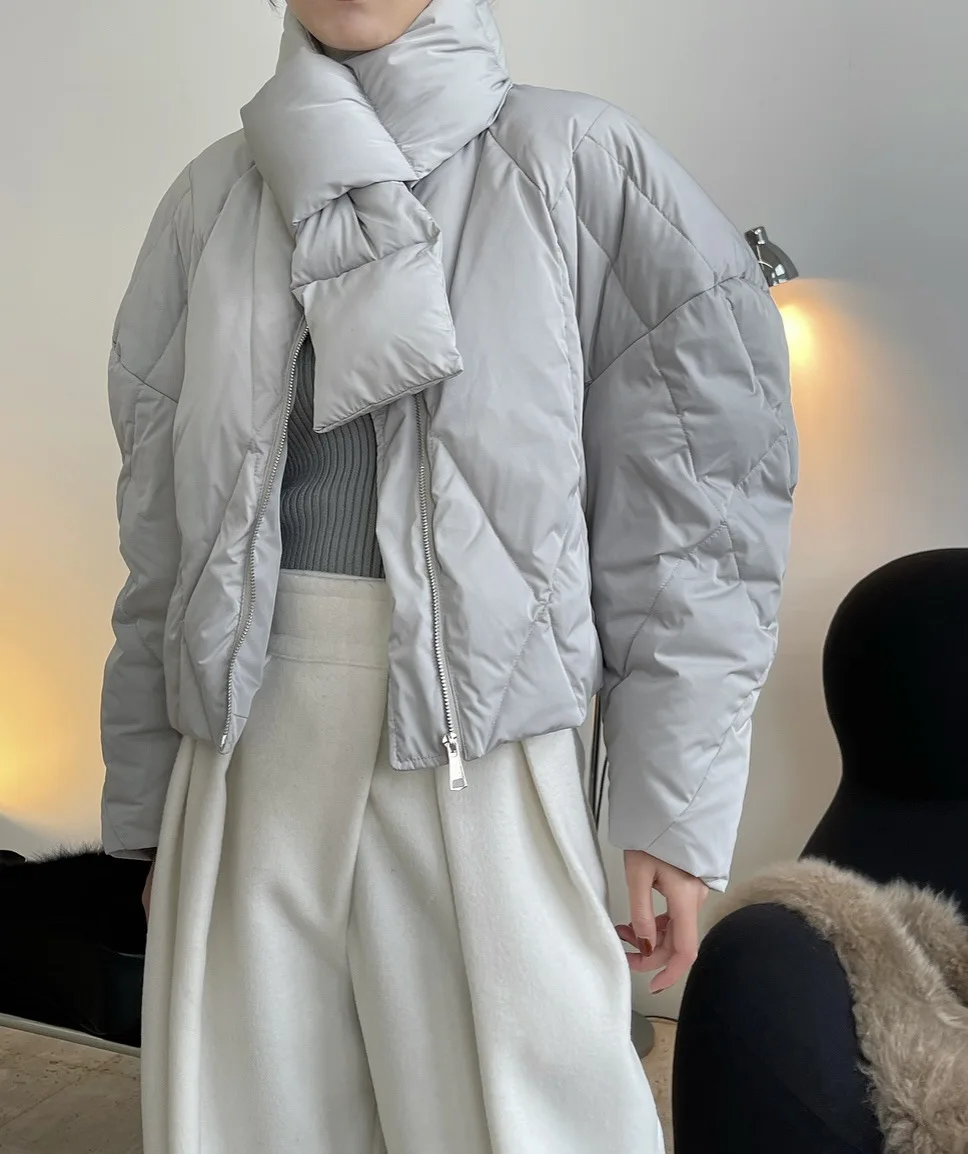 

woman fashion warm winter coat with fluff sleeves and scarf