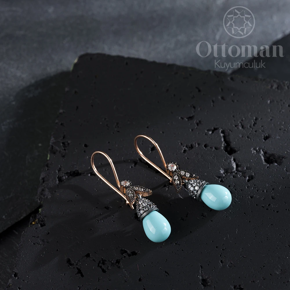 Turquoise Women's Silver Earrings Turquoise stone in the form of drops was used in our silver rose plated earring.