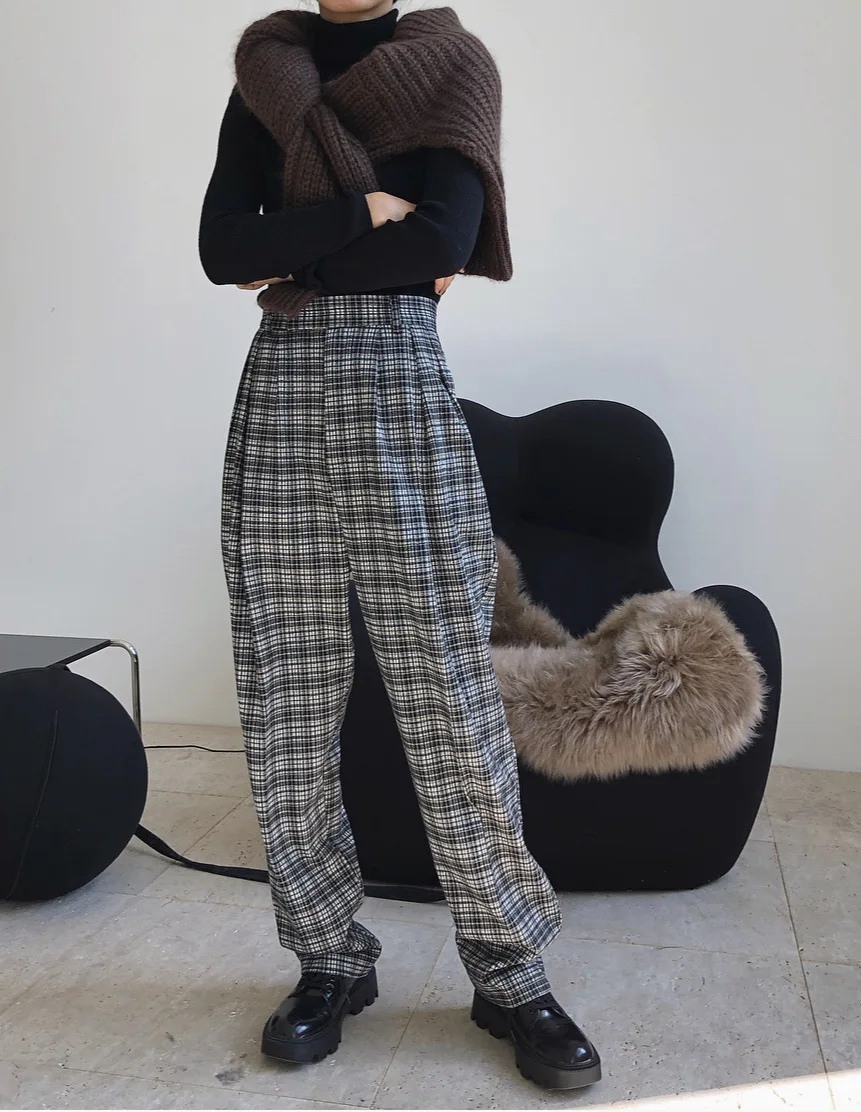 woman long woolen trousers from set without jacket