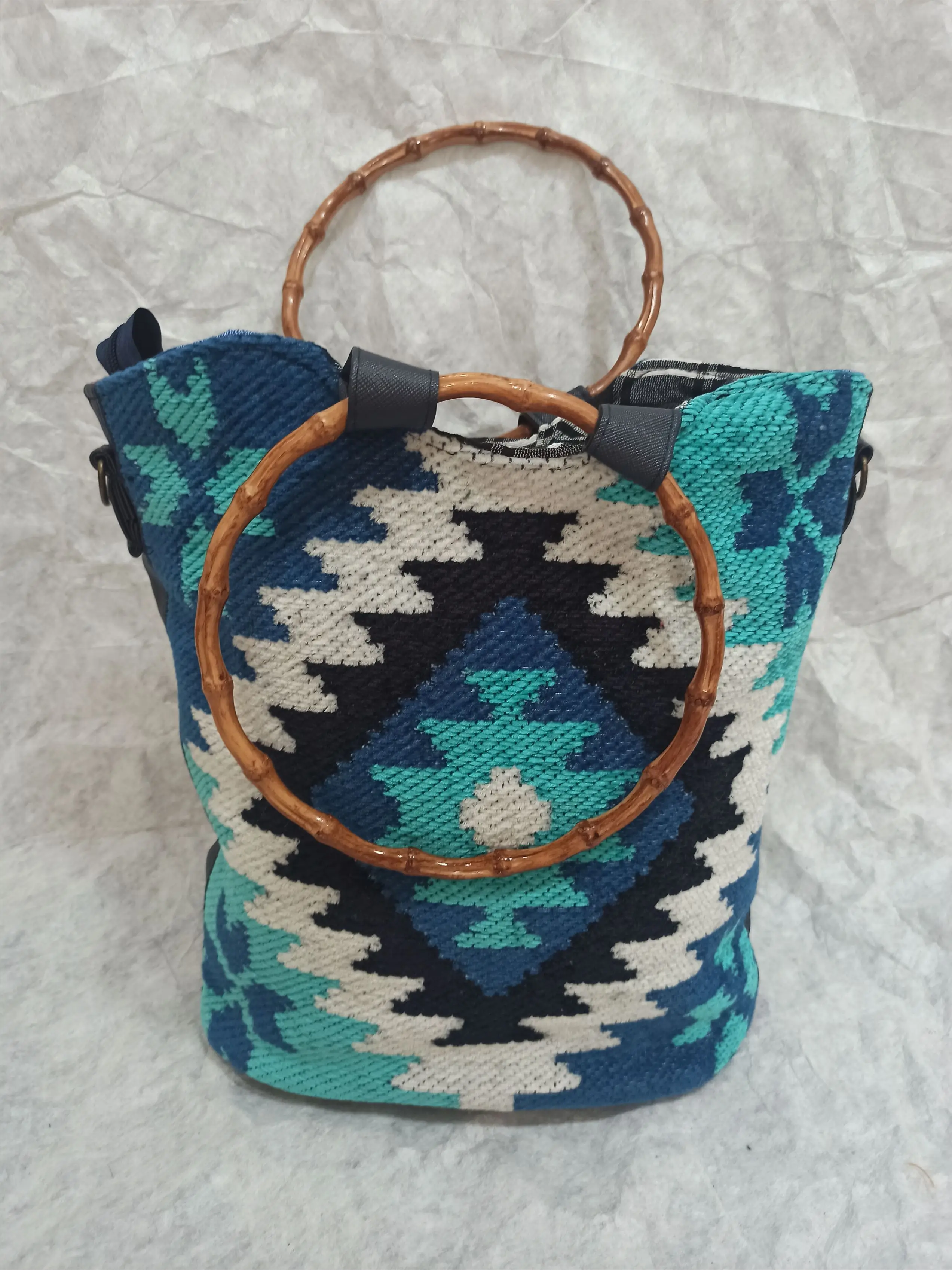 

Bone wooden bag. rugs and authentic patterns. red. orange. lilac blue. arm strap. don't hold hands leather strap. unique. limited production. great design. healthy yarn. very special craftsmanship. produced by root dye